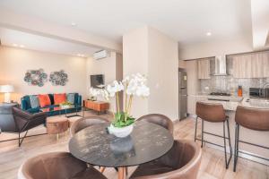 a living room with a table and chairs at Fully Serviced Apartment at Regatta Living - 3B in La Julia