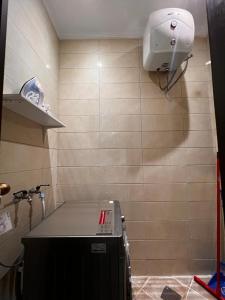 a bathroom with a sink and a camera on the wall at Khozama AlNahda in Jeddah +40 photos