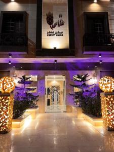 a lobby of a building with purple lights at Khozama AlNahda in Jeddah