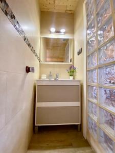 a bathroom with a sink and a shower at Casa en el MAR in Benicarló