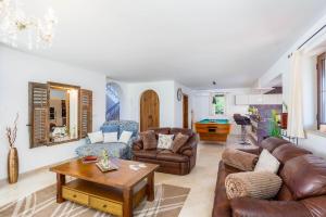 a living room with couches and a table at Kamenica in Kras