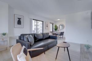 a living room with a couch and a table at Amazing studio front the Barton Park at Clarendon in Arlington