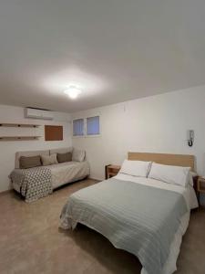 Postel nebo postele na pokoji v ubytování Casa Galiana.