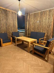 a room with a wooden table and chairs at Hotel Casa Cafur in Santa Ana