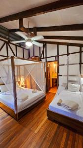 two bunk beds in a room with a ceiling at Pincoya in Punta Uva +14 photos