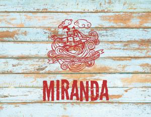 a logo for a pirate ship on a wooden table at Locanda Miranda in Tellaro