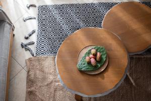 a plate of food on a wooden table at Xenonas Apollon in Sarti