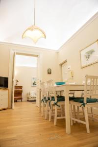 a dining room with a table and chairs at Sciacca's House in Centuripe