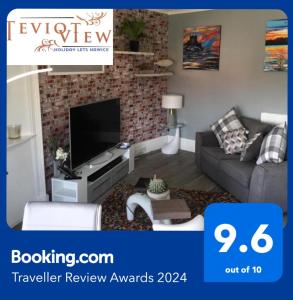 a living room with a couch and a tv at Teviot View Holiday Let’s Hawick in Hawick