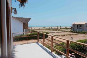 a balcony of a house with a view of the beach at NAUTICA CHINCHA Casa con Piscina frente al mar in Casa Blanca