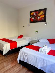 Postel nebo postele na pokoji v ubytování Residencial Marina House + 37 fotografií