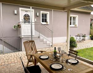 a table and chairs on a patio at Haus Silberberg in Haslach im Kinzigtal