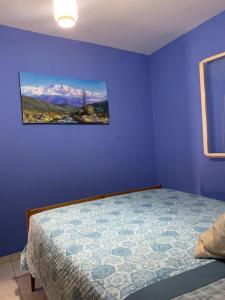 En eller flere senge i et værelse på Casa Ohana + 2 billeder