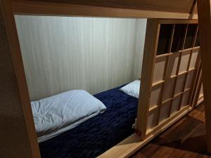 Postel nebo postele na pokoji v ubytování 大山ベースキャンプ Daisen Basecamp