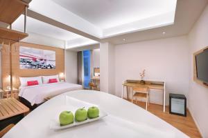 Postel nebo postele na pokoji v ubytování favehotel Palembang