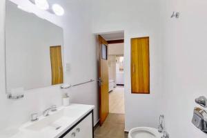 a bathroom with a sink and a toilet and a mirror at En el corazón de la ciudad! in Buenos Aires +31 photos
