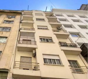 a tall building with balconies on the side of it at En el corazón de la ciudad! in Buenos Aires