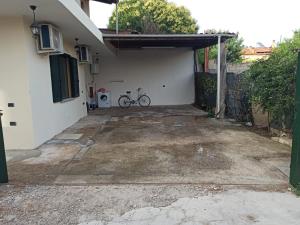 a bike parked in the garage of a house at Casa Adele in San Sperate