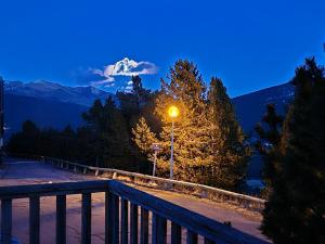 a street light with a mountain in the background at A l'orée des bois in Les Angles