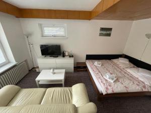 Postel nebo postele na pokoji v ubytování Apartmány Luhačovice