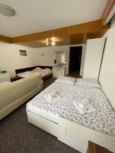 Postel nebo postele na pokoji v ubytování Apartmány Luhačovice