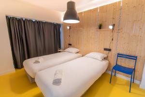 Postel nebo postele na pokoji v ubytování Koala Hostel Mercado