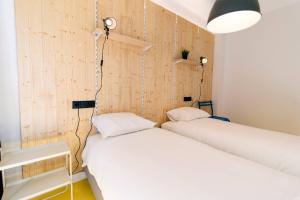 Postel nebo postele na pokoji v ubytování Koala Hostel Mercado
