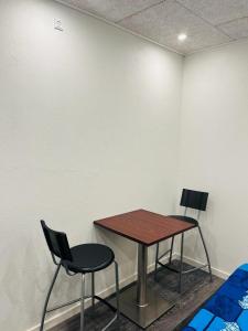 a table and two chairs in a room at Private Rooms in center of Billund in Billund