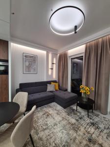 Posedenie v ubytovaní Luksusowy Apartament Bliska Wola SABA