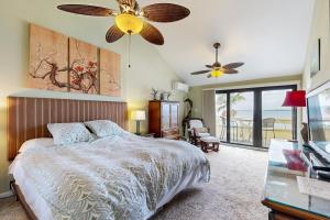 a bedroom with a bed and a ceiling fan at Buena Vida 17 in Navarre +17 photos