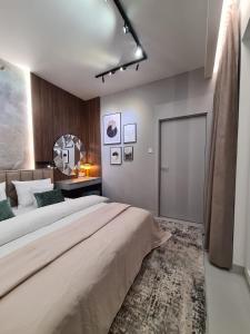Posteľ alebo postele v izbe v ubytovaní Luksusowy Apartament Bliska Wola SABA