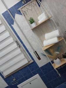 an overhead view of a bathroom with blue tile and stairs at Casa Seamus Briatico in Briatico +11 photos