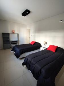 Ένα ή περισσότερα κρεβάτια σε δωμάτιο στο Consorcio María Auxiliadora1H