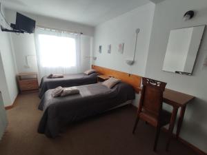 Una cama o camas en una habitación de Hosteria Puyehue