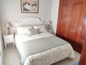 En eller flere senge i et værelse på Mina42 by 7Escalones