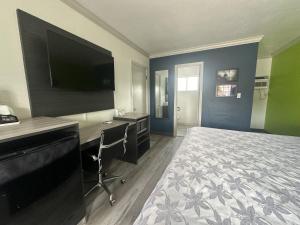 TV a/nebo společenská místnost v ubytování Signature Inn Winnemucca