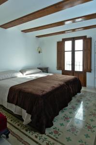 Tempat tidur dalam kamar di Casa Rural "ca Tona"