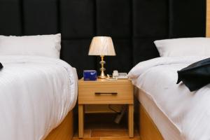 Letto o letti in una camera di Rizk Pyramids View Hotel