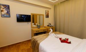 TV o dispositivi per l'intrattenimento presso Rizk Pyramids View Hotel