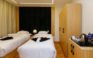 Letto o letti in una camera di Rizk Pyramids View Hotel
