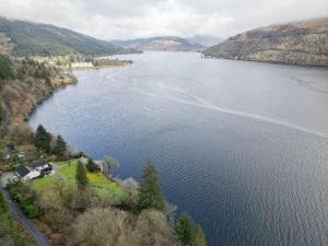an aerial view of a large body of water at WATERSIDE 3 BED COTTAGE, HOT TUB, SAUNA, PVT BEACH in Arrochar
