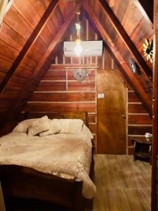 a bedroom with a bed in a attic at Hotel Luna Azul Tatacoa in Villavieja