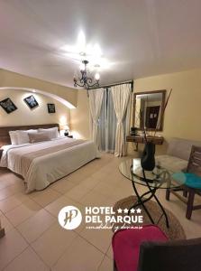 En eller flere senger på et rom på Hotel Del Parque