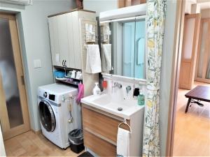 a bathroom with a washing machine and a sink at Mitoyo - House - Vacation STAY 15144 in Mitoyo