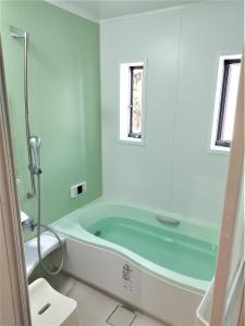 a bathroom with a bath tub in a room at Mitoyo - House - Vacation STAY 15144 in Mitoyo