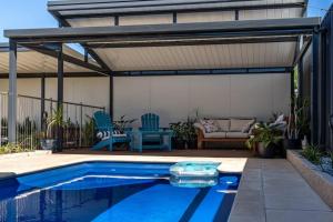a pavilion with a swimming pool in a backyard at Sailors' Retreat - Family Pool Oasis by Largs Beach in Largs