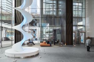 a lobby with a sculpture in a building at Presidential Suite Heart of Downtown with Stunning View in Toronto