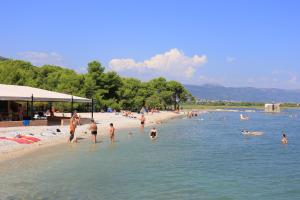 a group of people in the water at a beach at Family friendly house with a swimming pool Primorski Dolac, Zagora - 22653 in Primorski Dolac