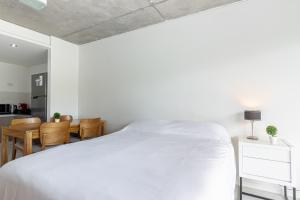 Кровать или кровати в номере NUEVO Loft Moderno a 5 Minutos de Puerto Madero