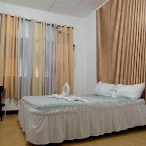 מיטה או מיטות בחדר ב-HOST HOMES - CASA ELIZA